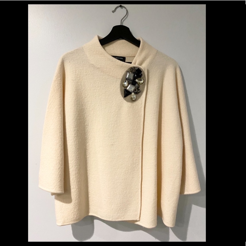 Cream shawl with decorative pin